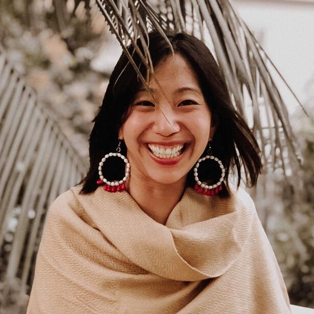 Headshot of Tiffany Yu, an Asian woman with brown hair and beige shawl